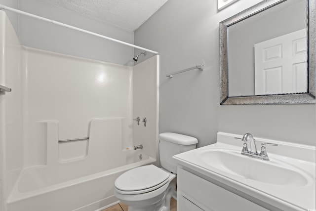 bathroom featuring toilet, a textured ceiling, vanity, and shower / bathing tub combination