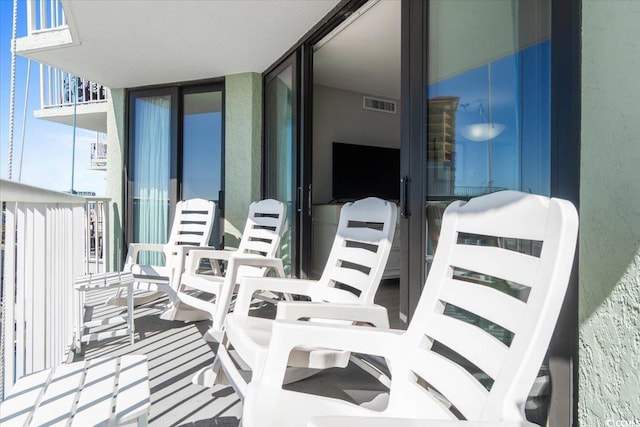 balcony featuring visible vents