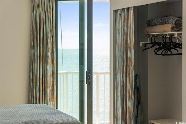 bedroom featuring a water view