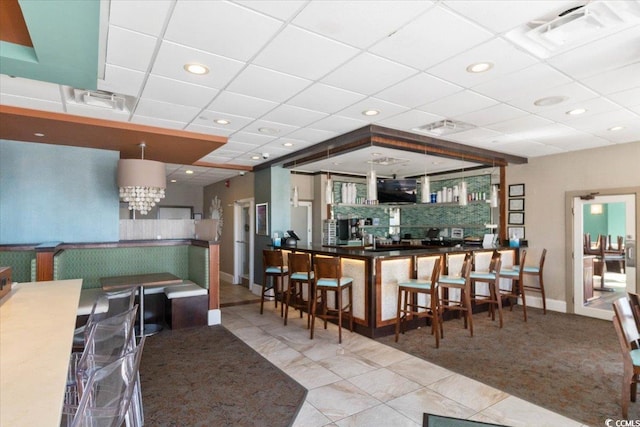 kitchen with a paneled ceiling, visible vents, recessed lighting, and tile patterned floors