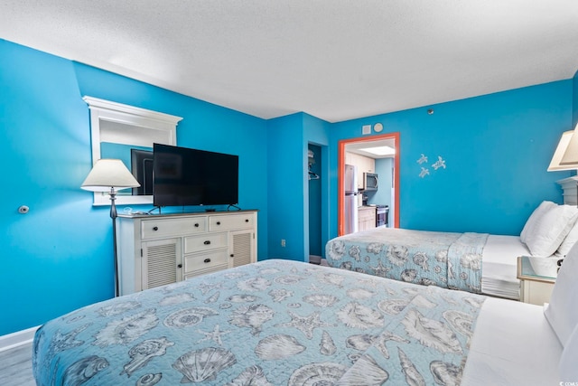 201 S Ocean Blvd Unit 217, Myrtle Beach, SC 29577 - bedroom with wood finished floors and baseboards