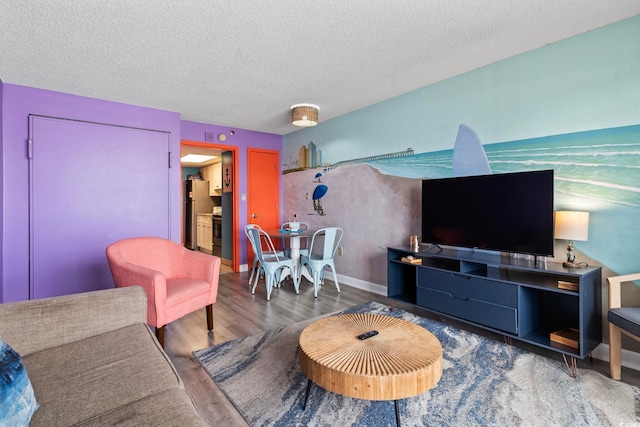 201 S Ocean Blvd Unit 217, Myrtle Beach, SC 29577 - living area with wood finished floors and a textured ceiling