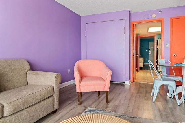 201 S Ocean Blvd Unit 217, Myrtle Beach, SC 29577 - sitting room with wood finished floors and baseboards