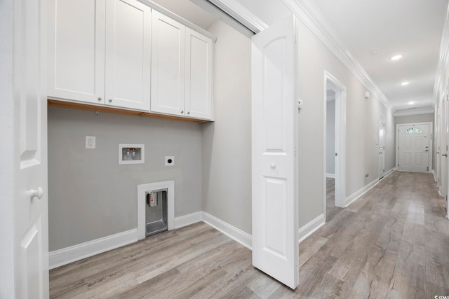 washroom featuring washer hookup, cabinet space, light wood-style floors, ornamental molding, and electric dryer hookup