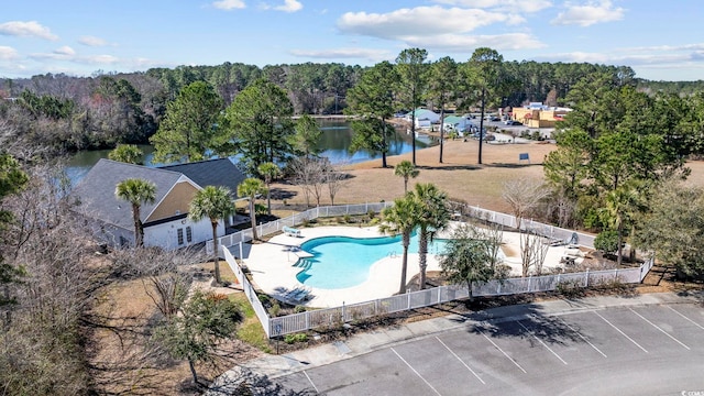 aerial view with a water view and a view of trees