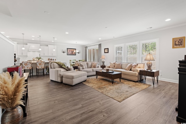 living room featuring visible vents, recessed lighting, crown molding, and dark wood-style flooring