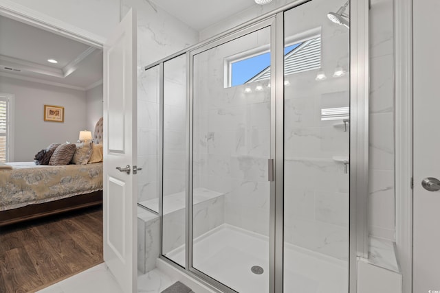 ensuite bathroom with a stall shower, wood finished floors, ensuite bath, recessed lighting, and crown molding