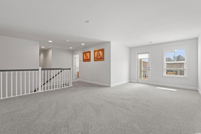 unfurnished room with carpet flooring, recessed lighting, and baseboards