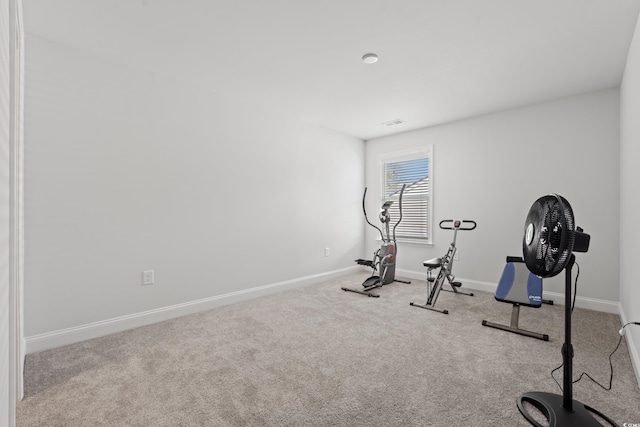 workout room featuring visible vents, carpet, and baseboards