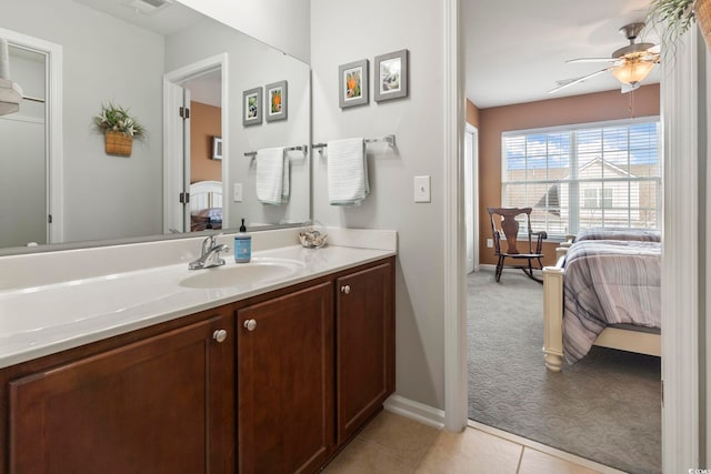 ensuite bathroom with visible vents, a ceiling fan, connected bathroom, tile patterned floors, and vanity