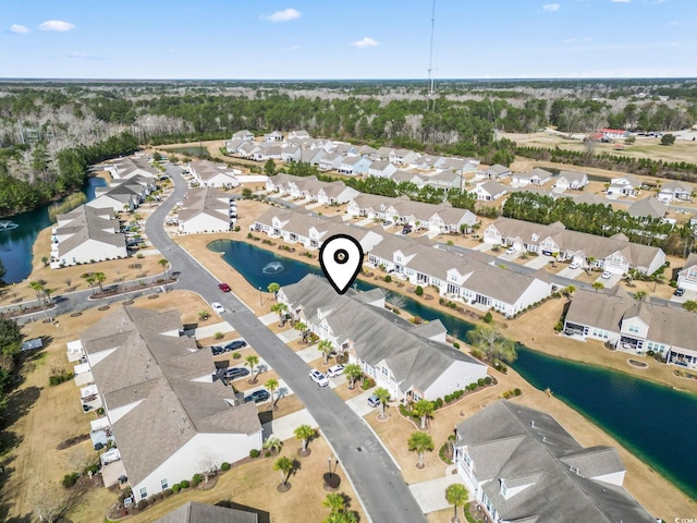 bird's eye view featuring a water view and a residential view