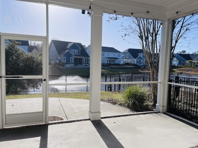 doorway to outside featuring a residential view