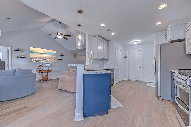 kitchen featuring open floor plan, light wood-style floors, visible vents, and double oven range