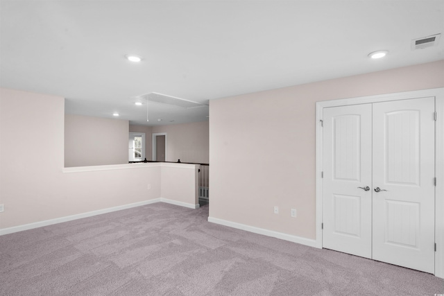 below grade area with recessed lighting, carpet flooring, visible vents, and baseboards