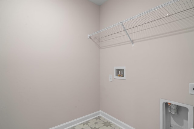 washroom featuring washer hookup, light floors, hookup for an electric dryer, laundry area, and baseboards