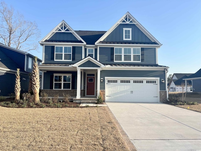 craftsman-style house featuring driveway, a standing seam roof, board and batten siding, an attached garage, and brick siding