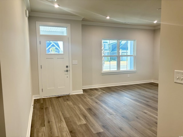 foyer with crown molding, recessed lighting, wood finished floors, and baseboards