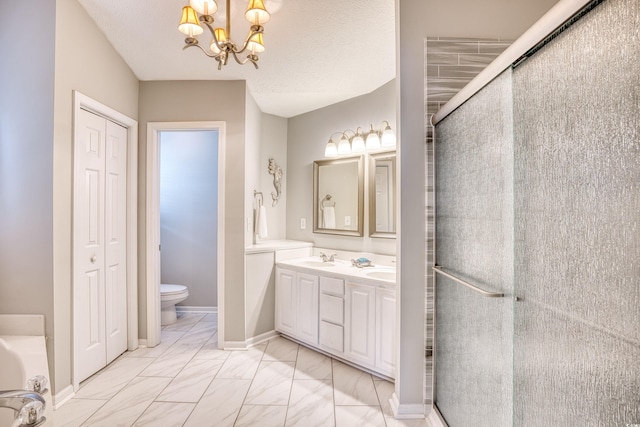 bathroom with toilet, marble finish floor, a shower stall, and a chandelier