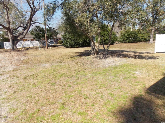 view of yard featuring fence