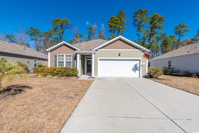 single story home with a garage and concrete driveway