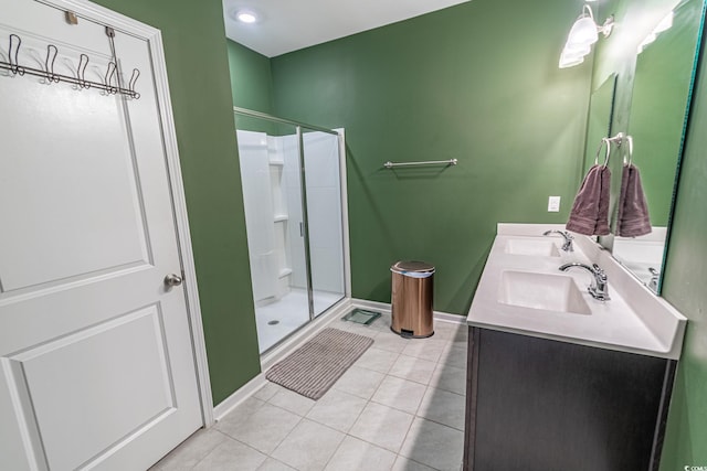 full bathroom with tile patterned flooring, a sink, and a shower stall