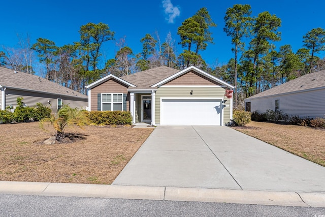 ranch-style home with an attached garage and concrete driveway