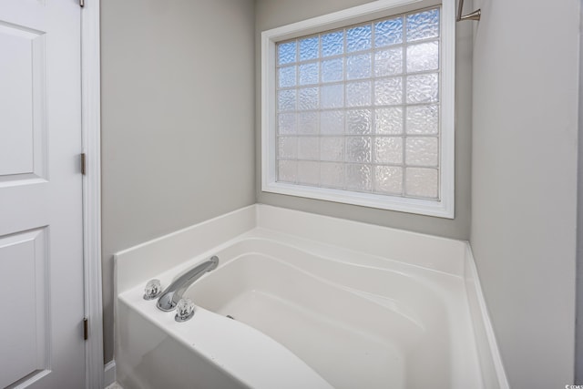 full bathroom with a garden tub