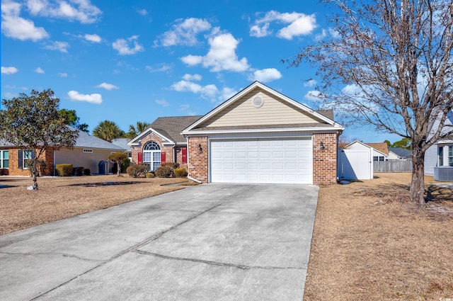 single story home featuring a garage, brick siding, concrete driveway, and fence