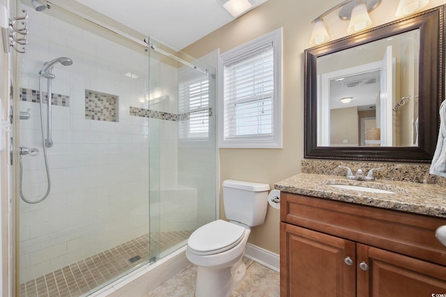 full bathroom with baseboards, toilet, tile patterned floors, vanity, and a shower stall