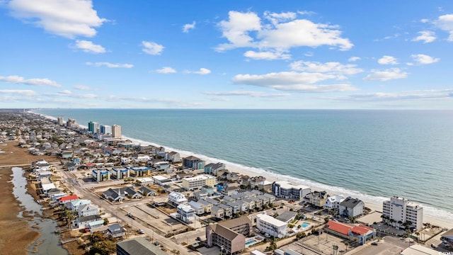 aerial view with a water view and a beach view