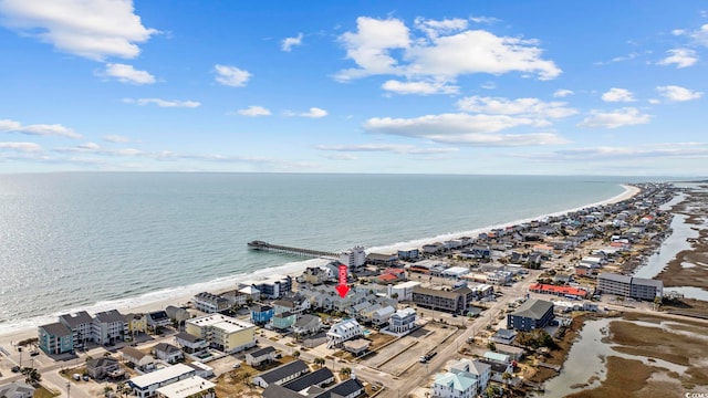 bird's eye view featuring a water view and a view of the beach