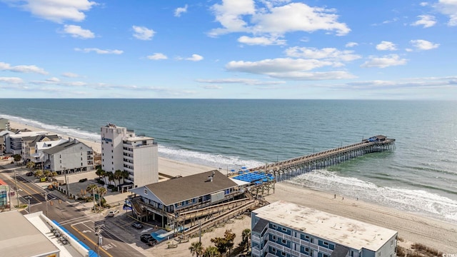 birds eye view of property featuring a water view and a view of the beach