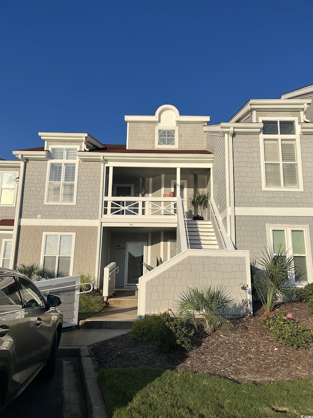 view of front of property with stairs