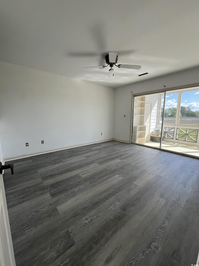 4396 Baldwin Ave Unit 141, Little River, SC 29566 - spare room with dark wood finished floors, a ceiling fan, and baseboards