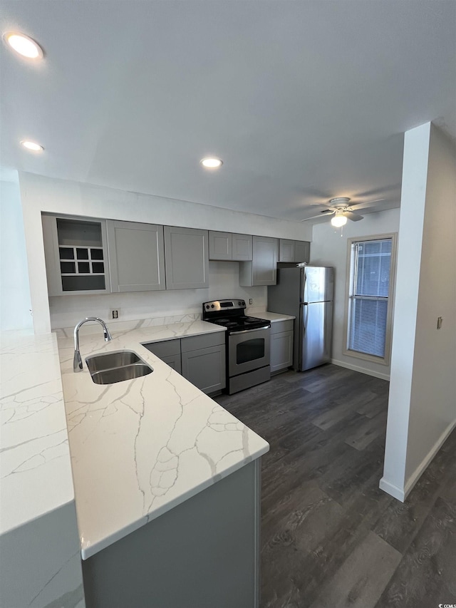 4396 Baldwin Ave Unit 141, Little River, SC 29566 - kitchen with stainless steel electric range oven, gray cabinets, a sink, freestanding refrigerator, and light stone counters