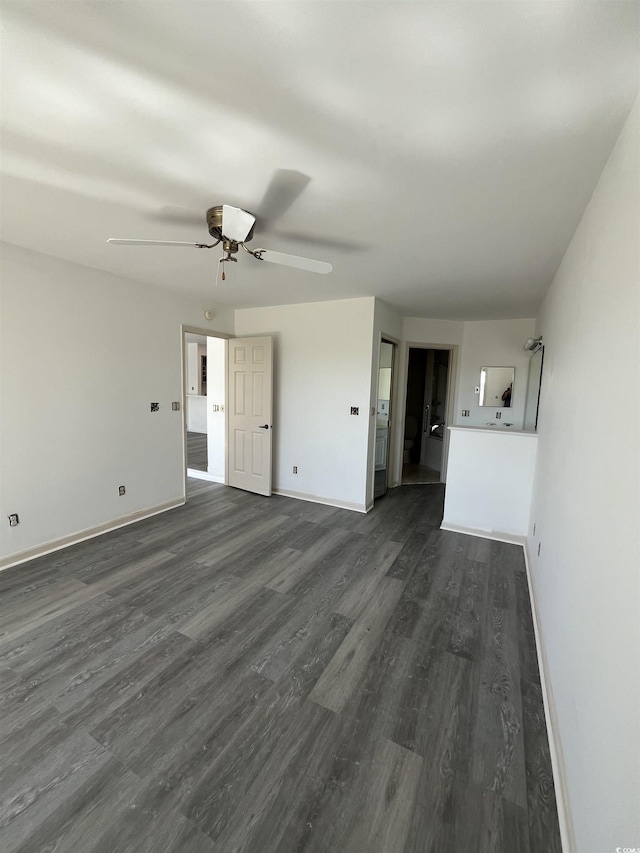 4396 Baldwin Ave Unit 141, Little River, SC 29566 - unfurnished living room featuring dark wood-style flooring, ceiling fan, and baseboards