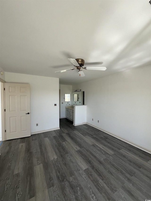 4396 Baldwin Ave Unit 141, Little River, SC 29566 - unfurnished living room with dark wood-style flooring, ceiling fan, and baseboards