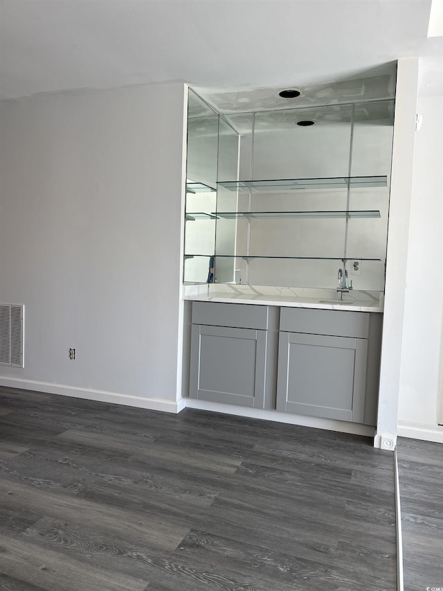 4396 Baldwin Ave Unit 141, Little River, SC 29566 - bar area featuring baseboards, dark wood-type flooring, and a sink