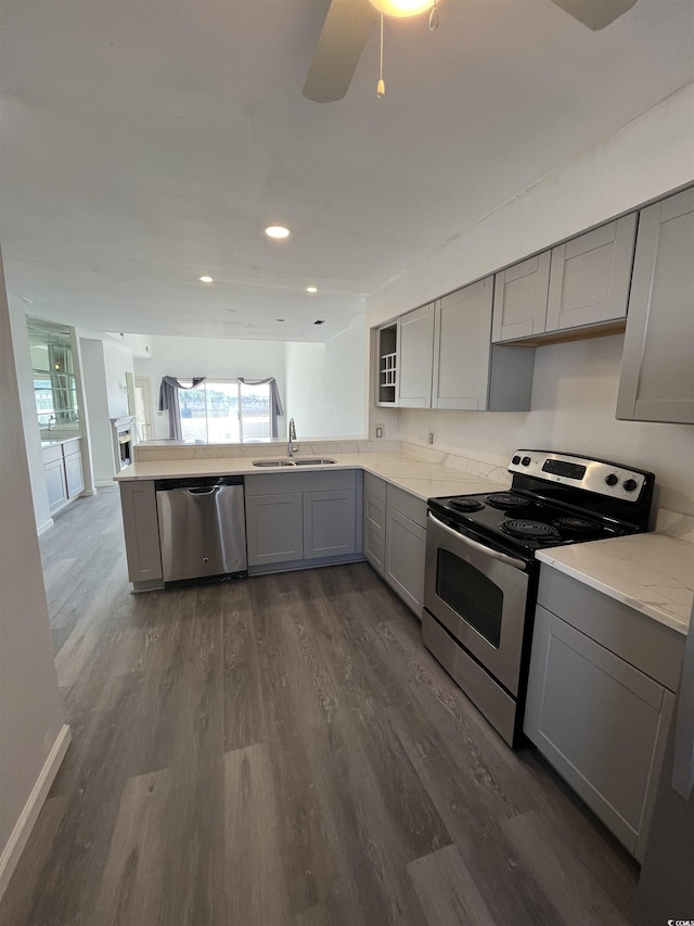 4396 Baldwin Ave Unit 141, Little River, SC 29566 - kitchen featuring stainless steel appliances, gray cabinets, a sink, dark wood-style flooring, and recessed lighting