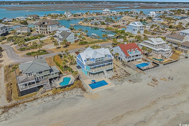 aerial view featuring a water view and a residential view