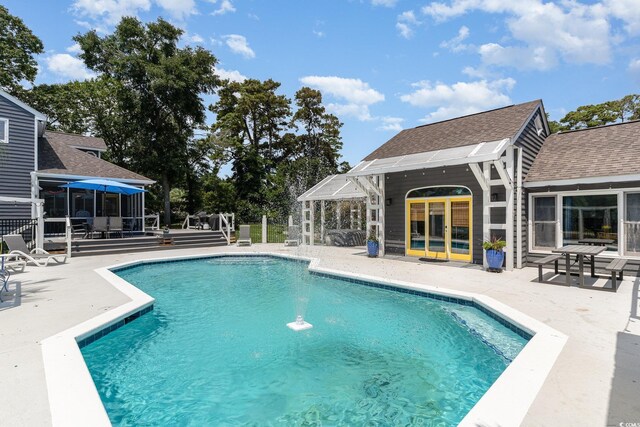 view of pool featuring a fenced in pool and a patio area