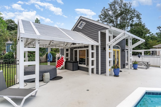 view of patio / terrace featuring fence and a fenced in pool