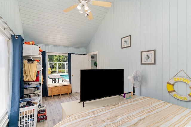 bedroom featuring wood finished floors, ceiling fan, and vaulted ceiling