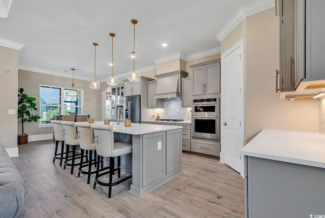 410 44th Ave N, Myrtle Beach, SC 29577 - kitchen with tasteful backsplash, gray cabinetry, a breakfast bar, ornamental molding, and stainless steel appliances