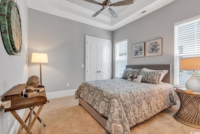410 44th Ave N, Myrtle Beach, SC 29577 - bedroom with light colored carpet, crown molding, a raised ceiling, a closet, and a ceiling fan