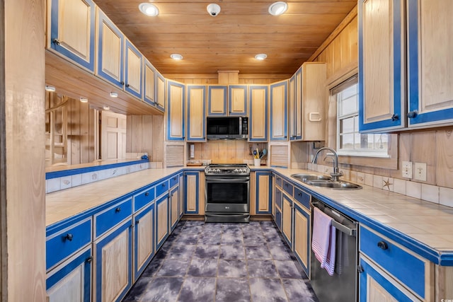 kitchen with tile countertops, recessed lighting, stainless steel appliances, a sink, and wood ceiling