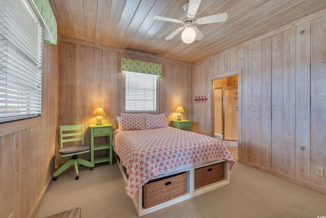 carpeted bedroom featuring wooden ceiling, wooden walls, and baseboards