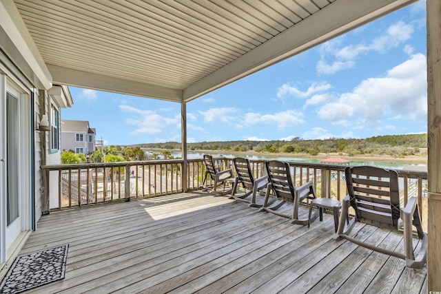 wooden deck with a water view