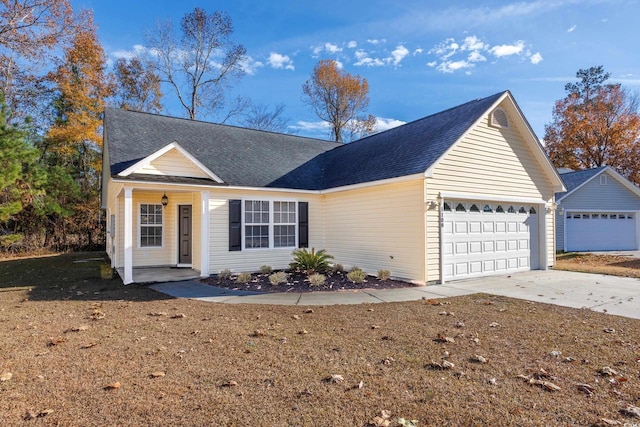 ranch-style house featuring an attached garage, concrete driveway, and a shingled roof