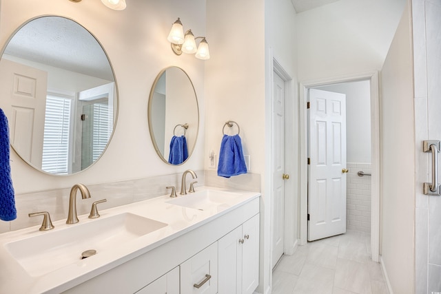 bathroom with double vanity and a sink